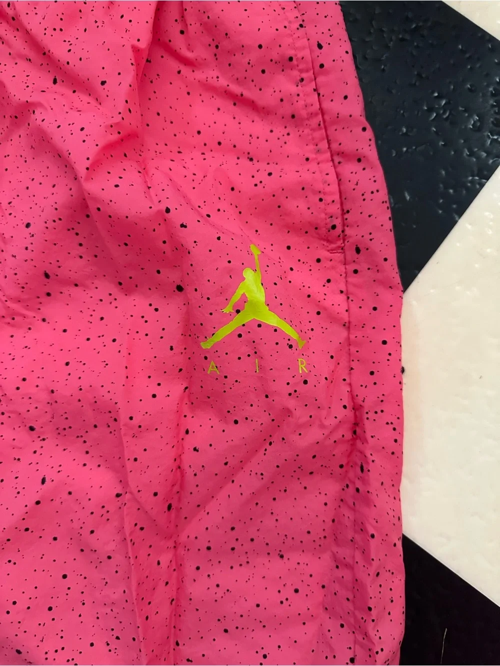 Jordan Men’s Pink Swim Trunks with Yellow Jumpman